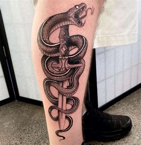 snake wrapped around leg tattoo|Unique Snake Wrapped Leg Tattoo Designs